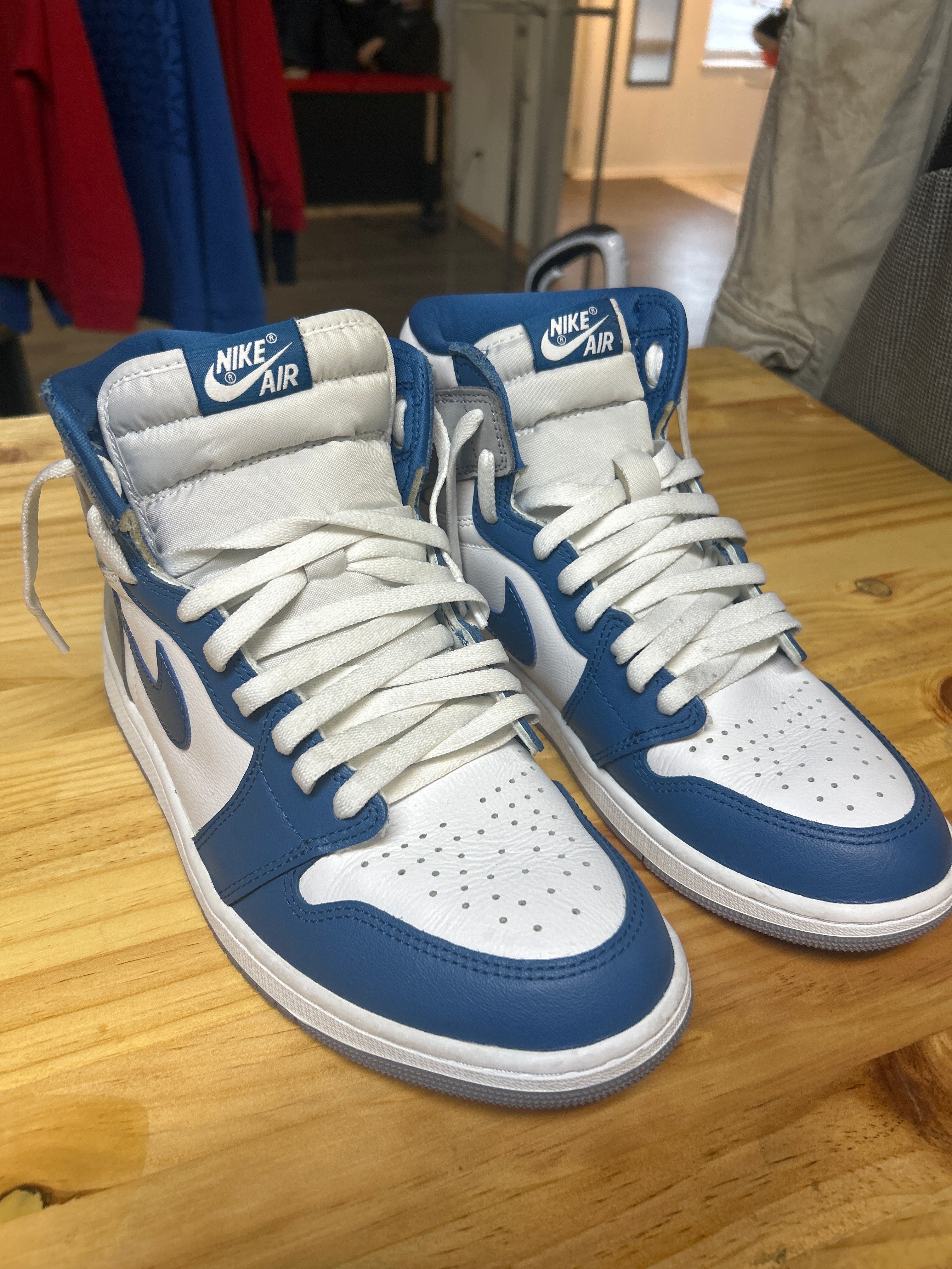 This is a Nike Air Jordan 1 Retro High OG "True Blue" sneaker.