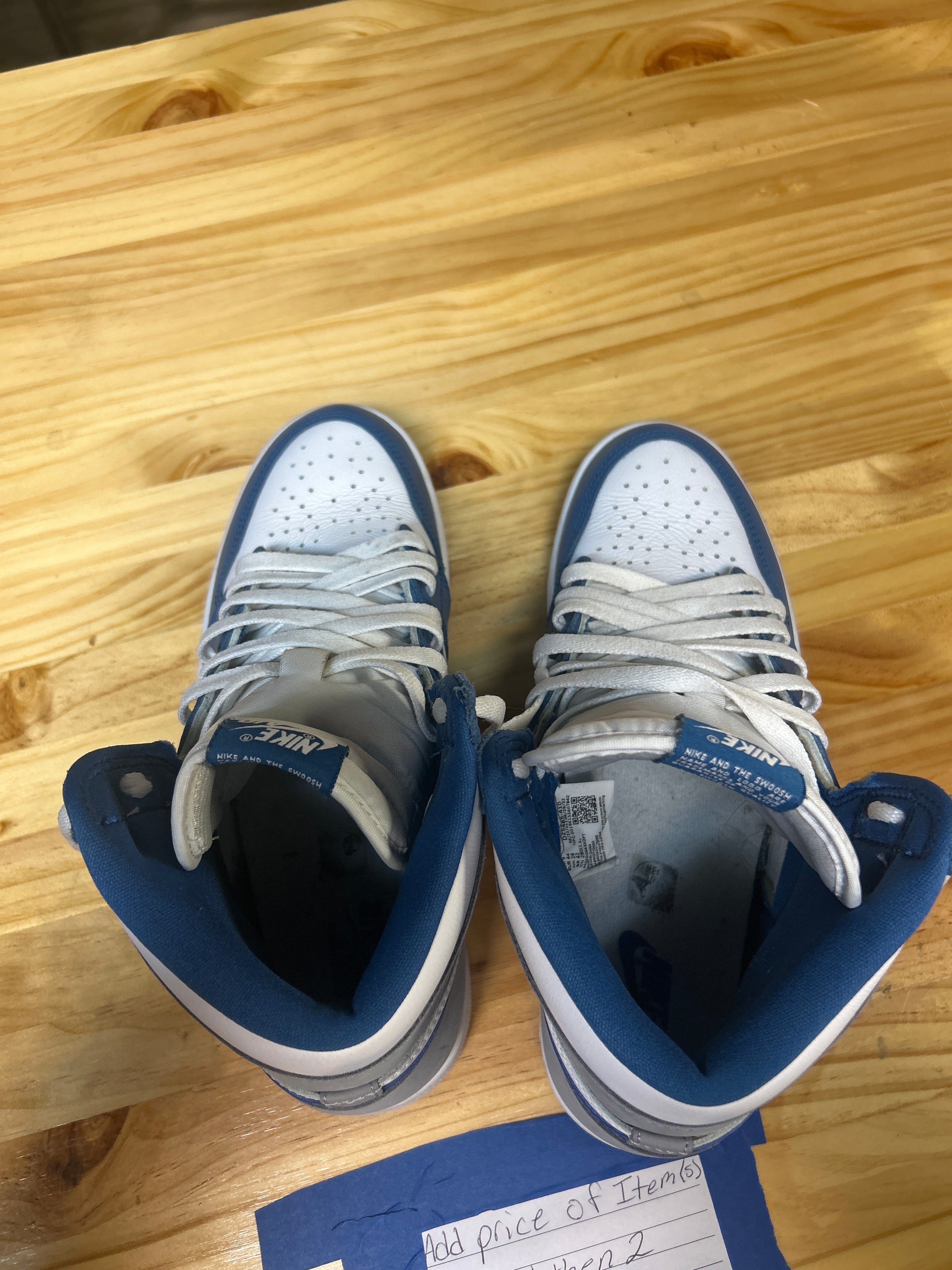 This is a Nike Air Jordan 1 Retro High OG "True Blue" sneaker.